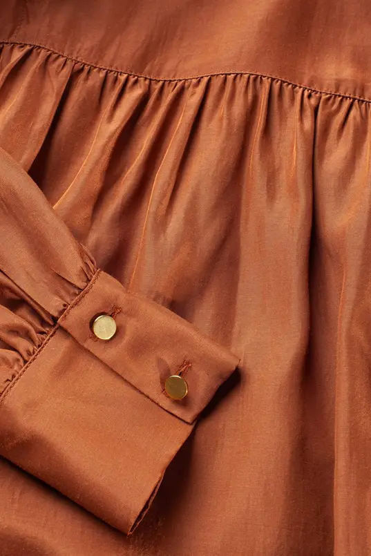 Glanzende blouse met col