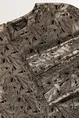 Jurk met metallic bladmotief