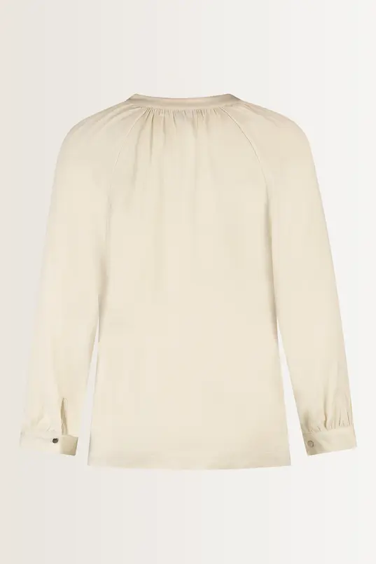 Losvallende blouse plooidetails