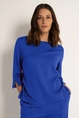 Soepele blouse met splitjes
