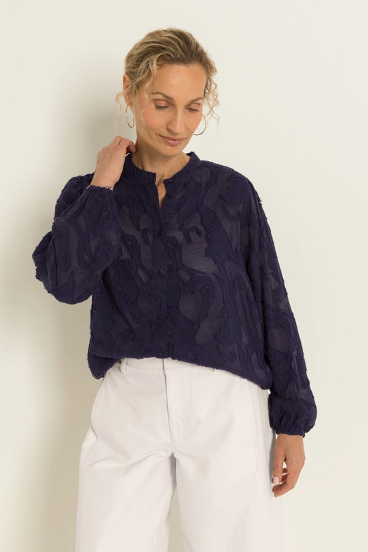 Transparante blouse met borduurstructuur