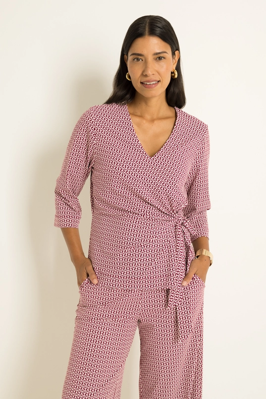 Travel top met overslag en strikdetail