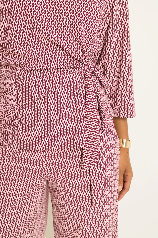 Travel top met overslag en strikdetail