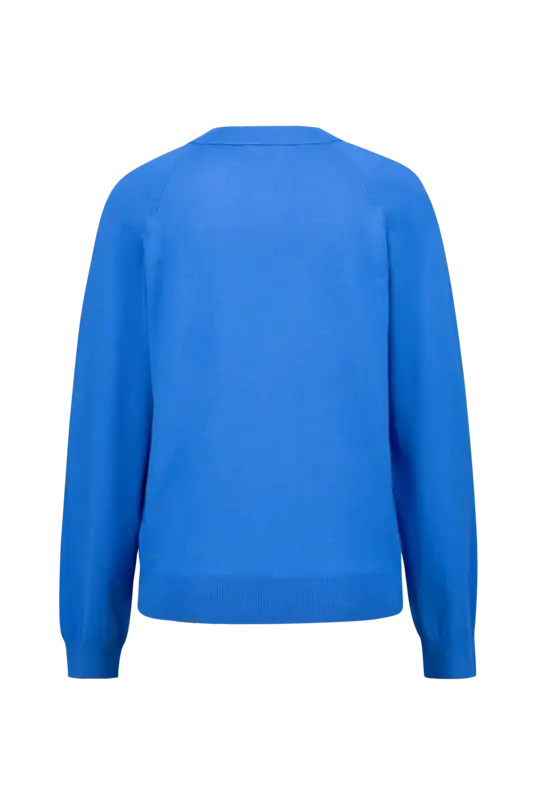 Trui met knoopdetail
